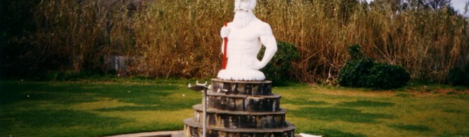 Photo of King Neptune in his original pond, comes from the personal collection of Suzanne Comelli, the daughter of Arturo who was the artisan who crafted Neptune from concrete, and 891 ABC Adelaide.