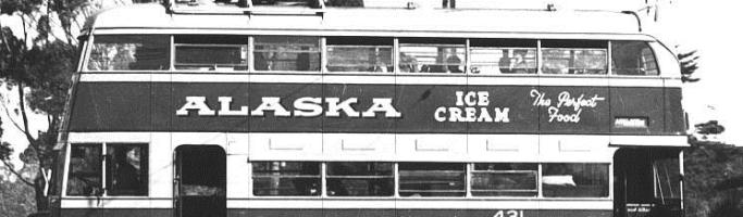 Photo from Wikipedia Commons. Double Decker Trolley Bus 1940s showing the front and rear entrances. Love the old advertising for Alaska Ice Cream, The Perfect Food!